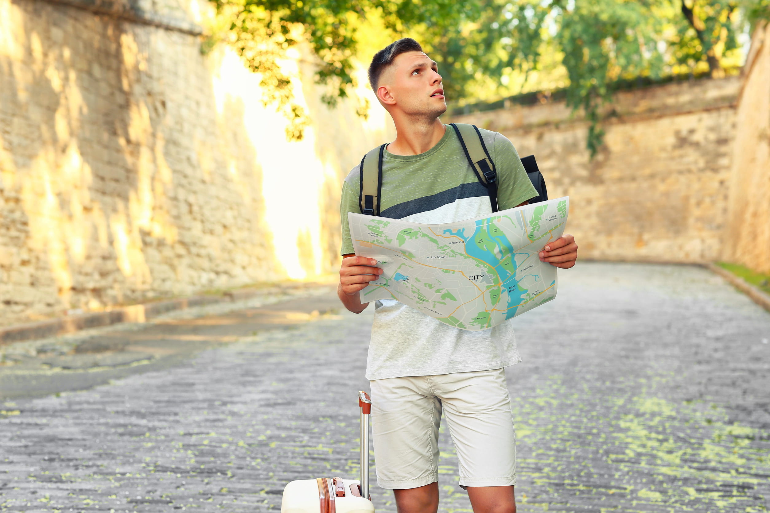 Male tourist with a map