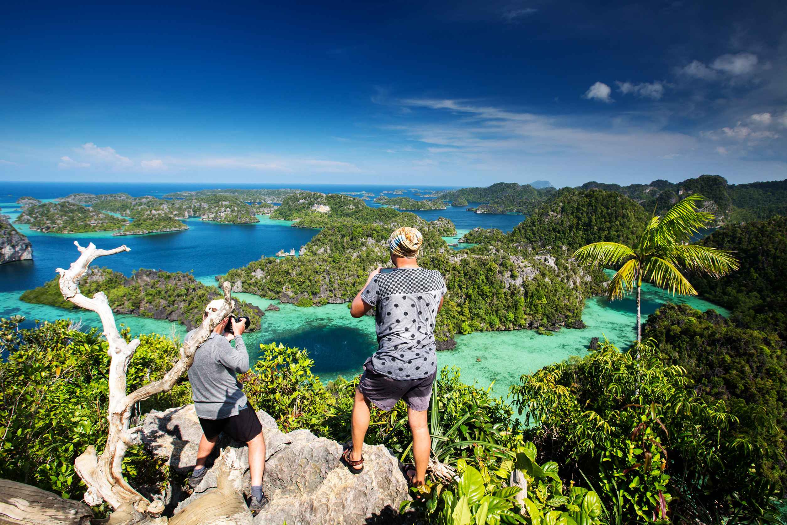 Tourist On The Top Of Puncak Harfat Viewpoint Raja Ampat Indonesia